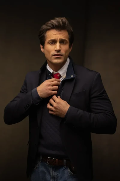 Professional Headshot of actor posing in blue jacket