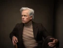 Professional Headshot of man posing on a chair