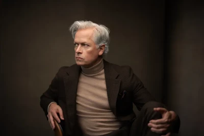 Professional Headshot of man posing on a chair
