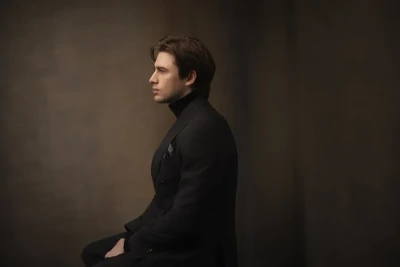 Professional Headshot of an actor sitting in the studio