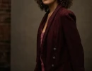 Professional Headshot of woman in a maroon blazer