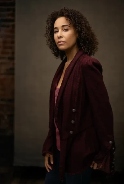 Professional Headshot of woman in a maroon blazer