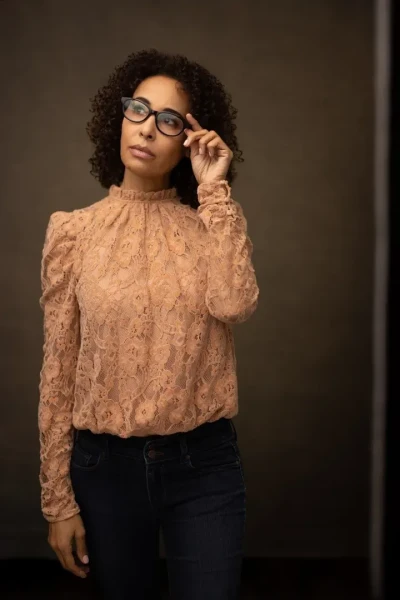 Professional Headshot of woman in pink with glasses