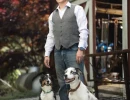 Branded photo of a man with his dogs