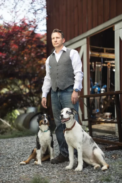 Branded photo of a man with his dogs
