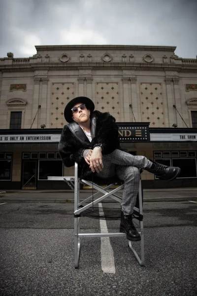 Lifestyle image of a man in front of a theater