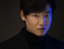 Professional Headshot of man in studio in blue lighting