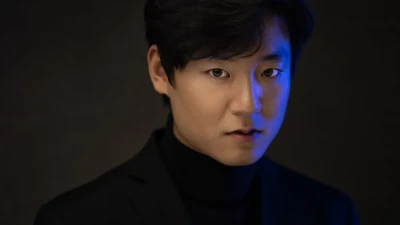 Professional Headshot of man in studio in blue lighting