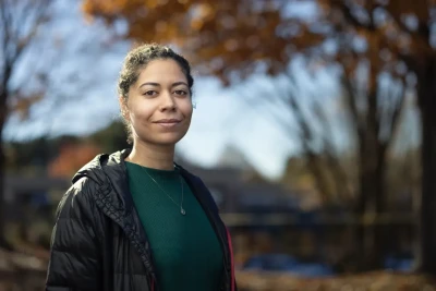 Professional Headshot of woman posing outside in fall