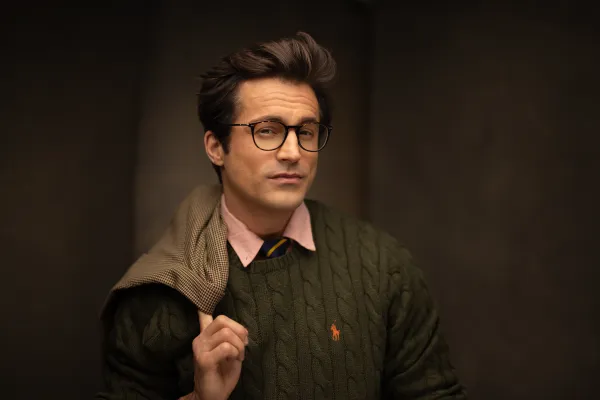 Studio portrait of an actor in a green sweater