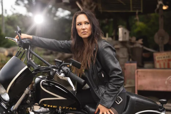 Artistic photograph of a woman on a motorcycle